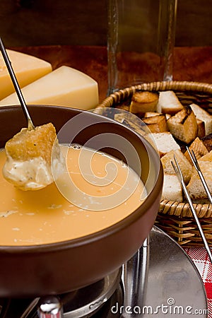 Cooking cheese fondue Stock Photo